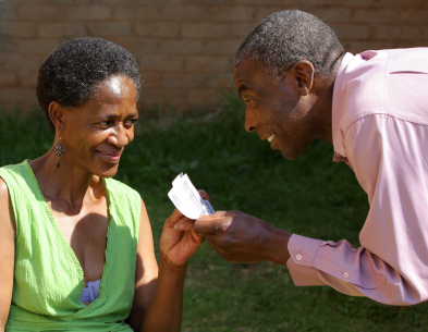 man giving to a elderly woman